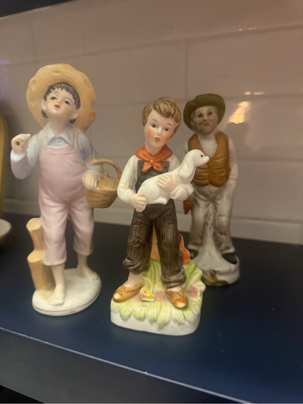 Porcelain Boy Figurine Holding Duck - White and Brown